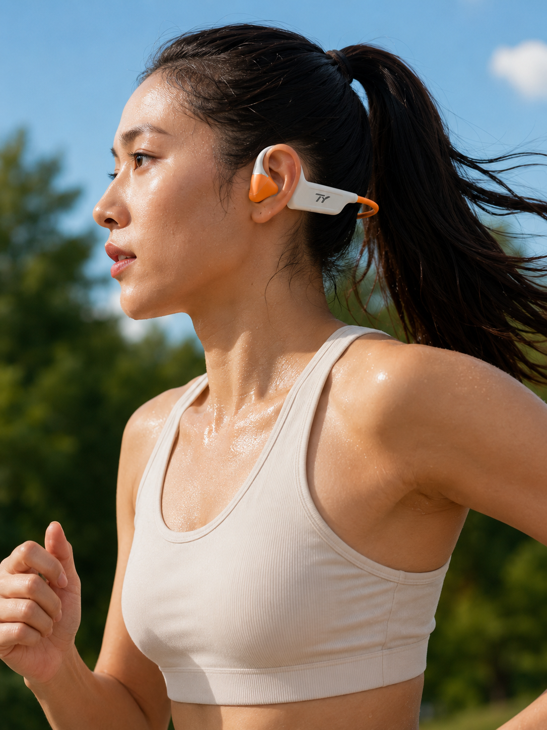 Runner wearing a white and orange TY headset
