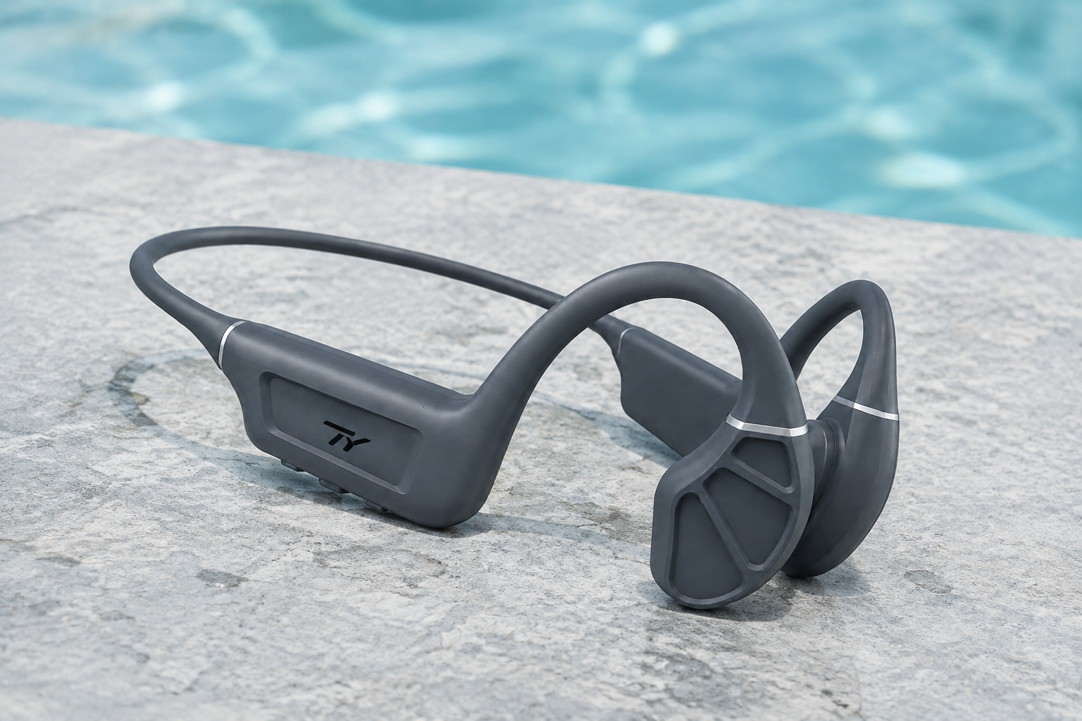 TY open-ear headset ready beside a swimming pool